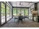 Elegant outdoor kitchen and dining area featuring a built-in grill and flagstone floors at 2112 Colin Hill Ct, Wake Forest, NC 27587