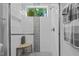 Bright, modern shower with a glass door and stone accent at 2112 Colin Hill Ct, Wake Forest, NC 27587