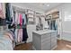 The walk-in closet provides ample storage with custom shelving and drawer units at 2112 Colin Hill Ct, Wake Forest, NC 27587