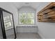 Charming window seat nook with cushioned seating, complemented by a mirror and stylish wall decor at 2112 Colin Hill Ct, Wake Forest, NC 27587