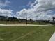 Outdoor community space with string lights, walking path, benches, and picnic tables at 2112 Pink Peony Cir # 149, Durham, NC 27703