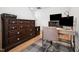 This well lit home office features a dark wood dresser and mini refrigerator at 237 Emory Bluffs Dr, Holly Springs, NC 27540