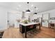 Bright kitchen with a center island, modern appliances, and stylish pendant lighting at 237 Emory Bluffs Dr, Holly Springs, NC 27540
