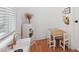 A creative play area is equipped with a toy kitchen and table set near a window at 237 Emory Bluffs Dr, Holly Springs, NC 27540