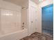 Bathroom with a tub/shower combo and a separate door leading to closet at 2826 Tulip Poplar Cir, Durham, NC 27704