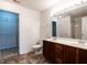 Bathroom with double vanity sinks, toilet, and walk-in closet access at 2826 Tulip Poplar Cir, Durham, NC 27704