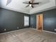 Cozy bedroom with neutral carpet, fan, and natural light at 2826 Tulip Poplar Cir, Durham, NC 27704