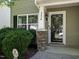 Charming front entrance featuring stone accents, a black door, and a bright, large window at 2826 Tulip Poplar Cir, Durham, NC 27704