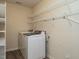 Convenient laundry room with washer, dryer, and wire shelving at 2826 Tulip Poplar Cir, Durham, NC 27704