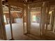 View of an unfinished interior featuring exposed wood framing, doorways, and subflooring at 30 Cherry Bark Dr, Youngsville, NC 27596