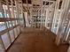 Interior view showcasing unfinished wood framing, exposed studs, and subflooring in the house at 30 Cherry Bark Dr, Youngsville, NC 27596