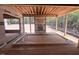 Unfinished patio featuring exposed wood framing, plywood, and door frames at 30 Cherry Bark Dr, Youngsville, NC 27596