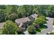 Lovely brick house nestled among trees with a well-manicured lawn on a quiet street at 308 Sutton Glen Dr, Apex, NC 27523