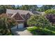 Brick home with two-car garage, mature trees, and manicured lawn in a desirable neighborhood at 308 Sutton Glen Dr, Apex, NC 27523