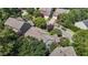 An aerial view of a lovely home with mature trees and beautifully landscaped surroundings in a great neighborhood at 308 Sutton Glen Dr, Apex, NC 27523