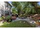 This home has a large back yard area featuring a wooden deck, patio, fire pit and backyard swing at 308 Sutton Glen Dr, Apex, NC 27523