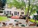 Enjoy a tranquil backyard boasting a custom deck, a stone firepit, and a swing for relaxing or entertaining at 308 Sutton Glen Dr, Apex, NC 27523