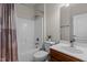 Functional bathroom with shower, bathtub, wooden vanity, and white sink at 308 Sutton Glen Dr, Apex, NC 27523