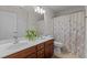 Bathroom featuring a double sink vanity, shower, tub, and neutral tile flooring at 308 Sutton Glen Dr, Apex, NC 27523
