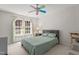 Bedroom with natural light, neutral colored walls, and a ceiling fan at 308 Sutton Glen Dr, Apex, NC 27523