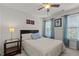 Cozy bedroom features a ceiling fan, natural light, and neutral-toned walls at 308 Sutton Glen Dr, Apex, NC 27523