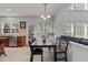 Bright breakfast nook with a wood table and chairs next to the kitchen area at 308 Sutton Glen Dr, Apex, NC 27523