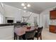 Open-concept breakfast nook with views of living room and staircase at 308 Sutton Glen Dr, Apex, NC 27523