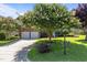 Well-maintained brick home featuring mature trees and a spacious two-car garage at 308 Sutton Glen Dr, Apex, NC 27523