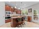 Charming kitchen with custom cabinets, stainless appliances, and a functional center island at 308 Sutton Glen Dr, Apex, NC 27523