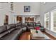 Spacious living room with a view of the kitchen, features a high ceiling and natural light at 308 Sutton Glen Dr, Apex, NC 27523