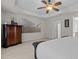 Bright main bedroom featuring a dresser, soft carpet, and doorways to the bathroom and closet at 308 Sutton Glen Dr, Apex, NC 27523
