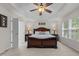 Inviting main bedroom with large bed, side tables, and natural light from the window at 308 Sutton Glen Dr, Apex, NC 27523