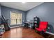 Home office with hardwood floors, large window, and ample space for a desk and seating at 308 Sutton Glen Dr, Apex, NC 27523