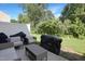 Relaxing backyard with patio furniture and a grill setup, perfect for outdoor entertaining at 3636 Water Mist Ln, Raleigh, NC 27604