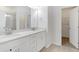 Bright bathroom with double sinks, white cabinets, and a walk-in shower at 3636 Water Mist Ln, Raleigh, NC 27604