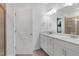 Bathroom featuring double vanity with sleek cabinets, spacious shower, and modern fixtures at 3636 Water Mist Ln, Raleigh, NC 27604