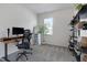 Functional bedroom with a desk, decorative shelving, a leaning mirror, and a large window for natural light at 3636 Water Mist Ln, Raleigh, NC 27604