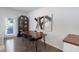Contemporary dining area featuring hardwood floors, industrial lighting, and modern decor at 3636 Water Mist Ln, Raleigh, NC 27604
