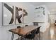 Modern dining room featuring hardwood floors, industrial lighting, and a view to the outdoor patio at 3636 Water Mist Ln, Raleigh, NC 27604