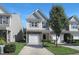 Inviting two-story home featuring a one-car garage, stone accents, and professionally maintained landscaping at 3636 Water Mist Ln, Raleigh, NC 27604