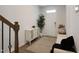 Inviting foyer with hardwood floors, staircase, and a stylish console table with decorative accents at 3636 Water Mist Ln, Raleigh, NC 27604
