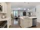 View of kitchen island that opens to an inviting living room at 3636 Water Mist Ln, Raleigh, NC 27604