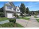 Charming townhomes with manicured lawns, private driveways, and attractive landscaping at 3636 Water Mist Ln, Raleigh, NC 27604