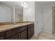 Elegant bathroom with double sinks, granite countertop, and dark wood cabinetry at 3810 Prince Noah Loop, Wake Forest, NC 27587