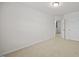 Empty bedroom with plush neutral carpet, white walls, and an attached bathroom at 3810 Prince Noah Loop, Wake Forest, NC 27587