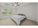 Comfortable bedroom with soft carpet, neutral walls, and a large window for natural light at 3810 Prince Noah Loop, Wake Forest, NC 27587