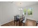 Bright dining space with wood floors, a chandelier, and natural light at 3810 Prince Noah Loop, Wake Forest, NC 27587