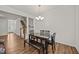 Elegant dining area with wood floors and views of the staircase at 3810 Prince Noah Loop, Wake Forest, NC 27587
