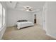 Spacious main bedroom with a tray ceiling, ceiling fan, and neutral carpet at 3810 Prince Noah Loop, Wake Forest, NC 27587