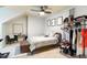 Bedroom featuring a ceiling fan, accent chair, and walk-in closet at 4203 Overcup Oak Ln, Cary, NC 27519